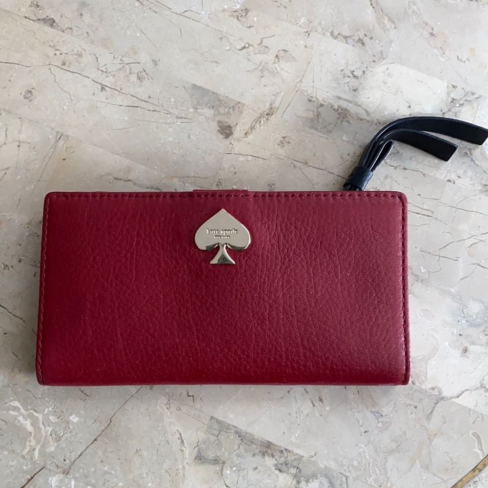 Slim and sleek burgundy Kate Spade wallet